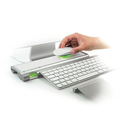 Wireless charging dock for Apple Magic Mouse and keyboard with hand placing mouse on charger